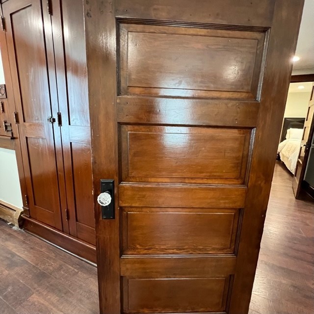All doors are wood with glass handles